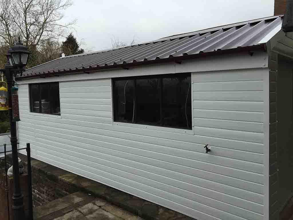 White Garage Cladding & Two Windows