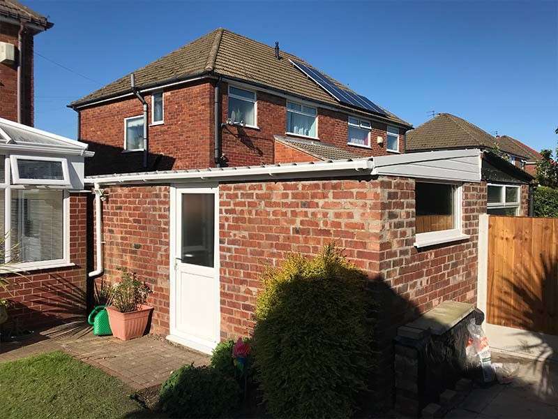 Adjoined Garage with New Profiled Roofing System Garage roof replacement of an adjoined garage