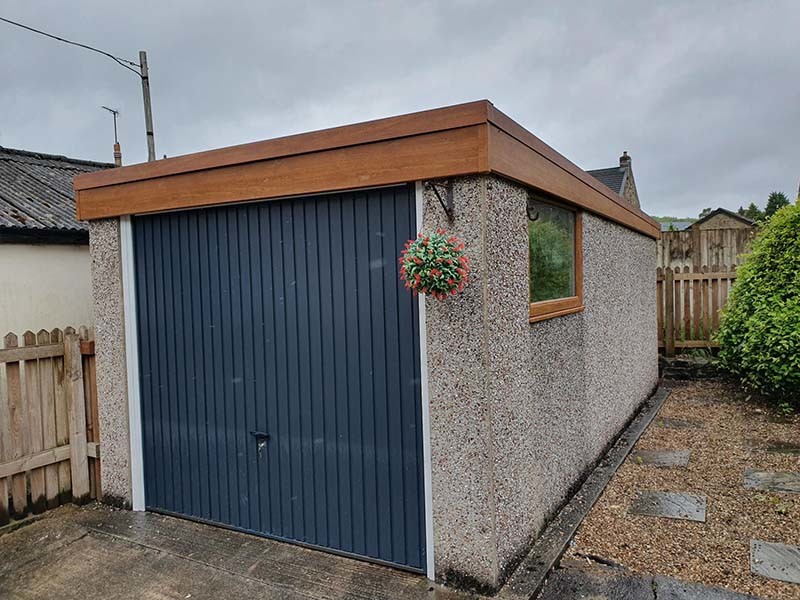 Refurbished Concrete Garage with Blue Garage Door