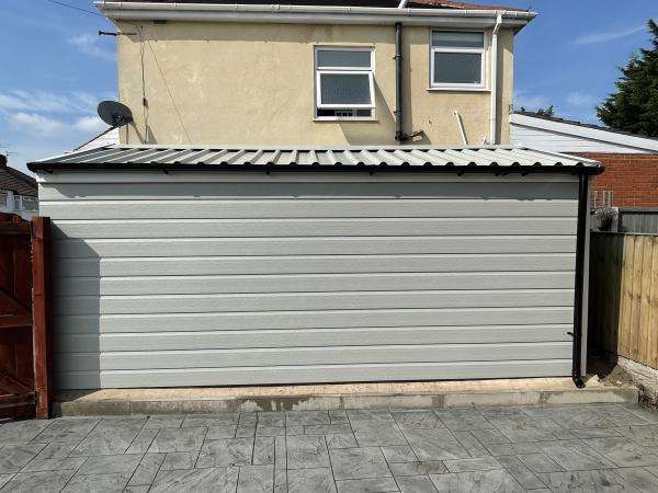 Garage Wall Covered with uPVC Cladding uPVC Cladding over Garage Wall