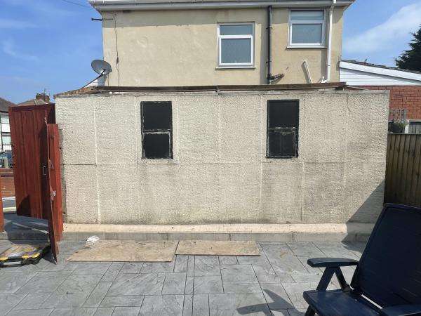 Old Garage Wall with Two Window Openings