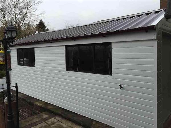 Apex Garage with Cladding and Brown garage roof Fully Cladded Garage with a New Garage Roof