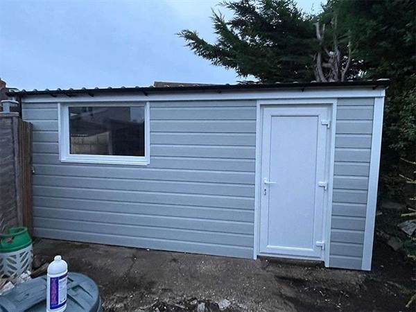 Cladded Garage with Replacement Side Door and Window Grey Cladded Garage with Solid Side Door and Window