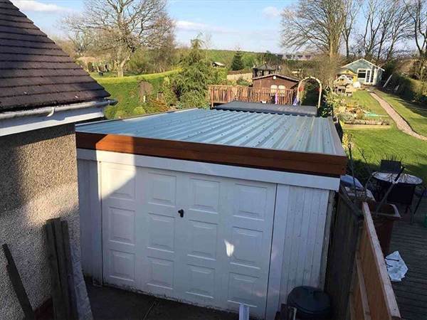 Garage Roof Replacement with Oak Fascia Finishes Wide single garage with new roof and Oak Fascia