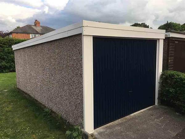 Pent Garage with a New Garage Door Concrete Garage Refurbishment with New Garage Door