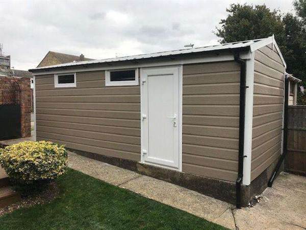 Solid White uPVC Side Door and Cladding Fully Cladded Garage with New Garage Roof and solid White Door