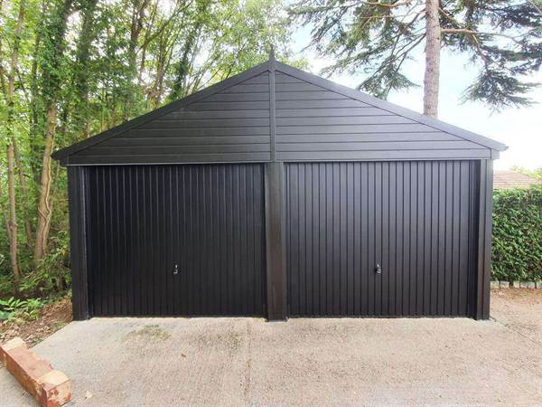 Double Garage Refurbishment with Twin Garage Doors Black Cladded Double Garage With Doors