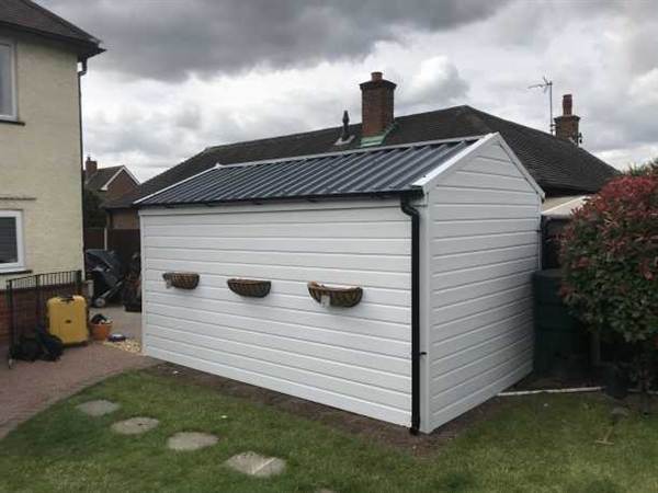 Garage Refurbishment Wrapped in uPVC Cladding Fully cladded garage with black garage roof