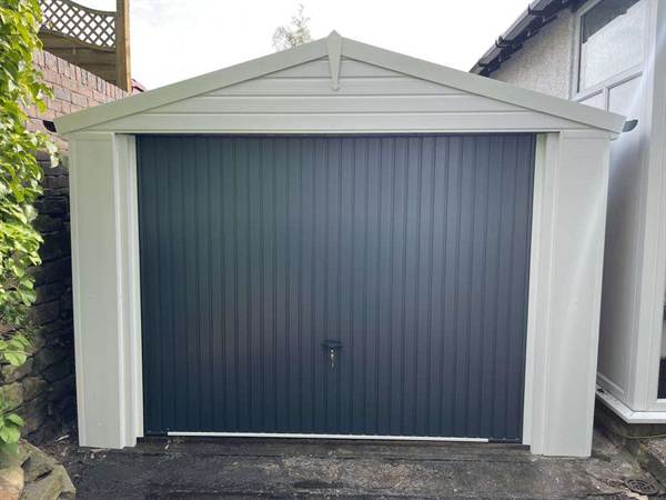 Garage Refurbishment with Blue Garage Door Concrete Garage with White Cladding and Blue Vertical Lined Garage Door