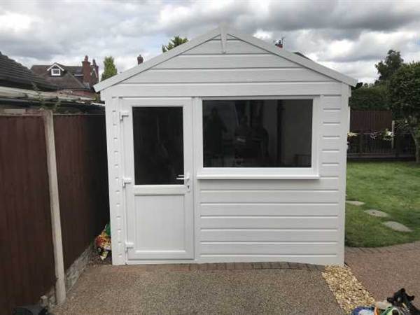 Garage Refurbishment with Garage Door Conversion Garage with garage door converted into a Side Door and Window