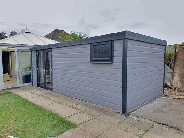 Garage Refurbishment with Grey Cladding Concrete Garage with Grey Cladding and White French Doors