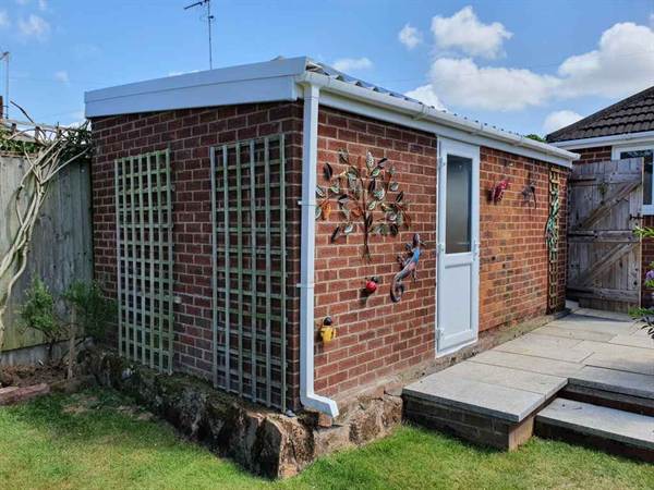 Garden Garage Renovation Small Garage in a back garden refurbished with new roof and side door