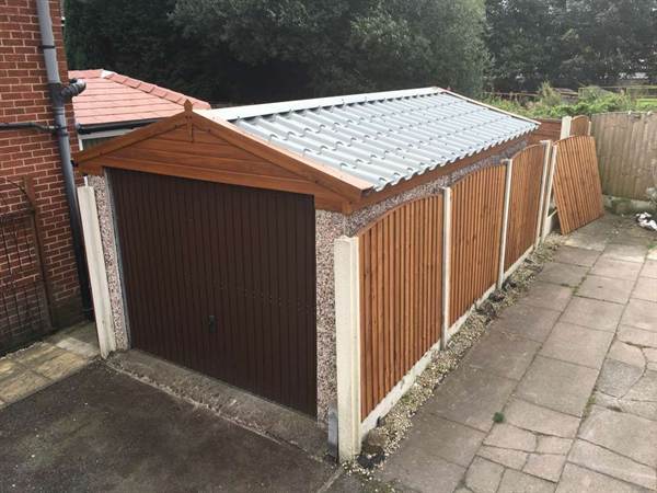 Refurbished Garage with Tile Effect Roof Brown Garage Door Single Garage with Tile Effect Roofing Panels and New Garage Door