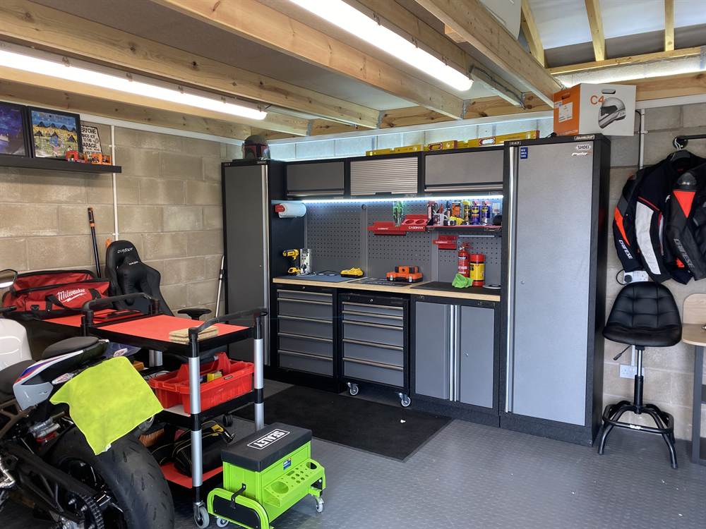 Garage Storage Conversion with Shelving and Cabinets